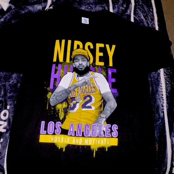 Tops - Nipsey Hustle tee 💜💛